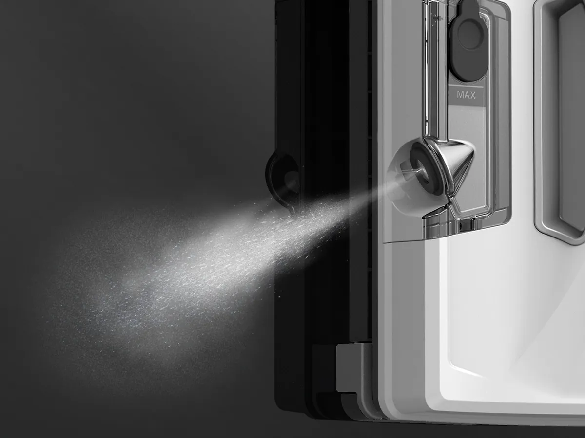 HOBOT S7 Pro ultrasonic nozzle spraying a fine mist onto glass